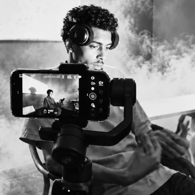 Creator filming with a phone on a gimbal